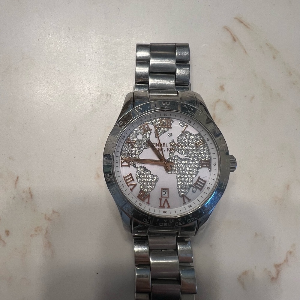 Woman’s Michael Kors Silver & Rose Gold World Map w/ Crystals